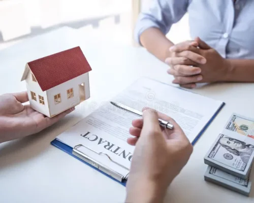 sale-purchase-contract-to-buy-house-real-estate-agent-presenting-home-loan-giving-keys-to-customer-signing-168621797